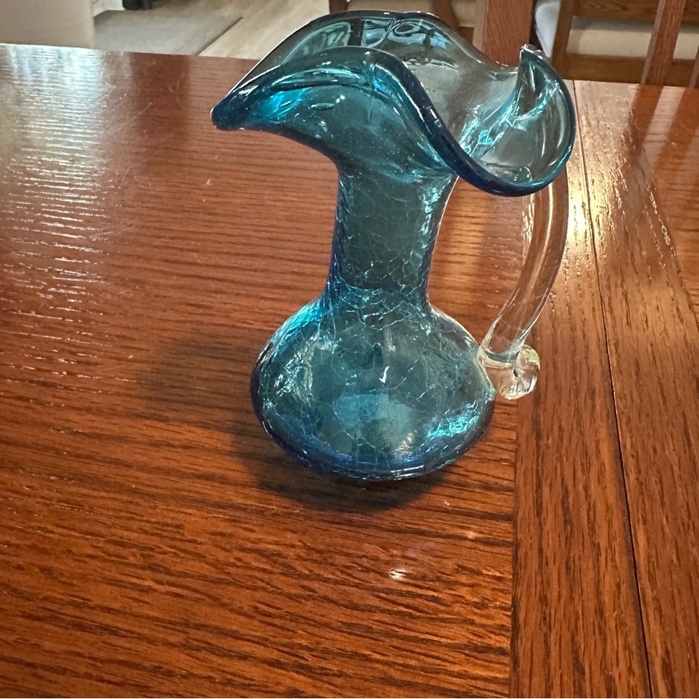 Small blue glass pitcher